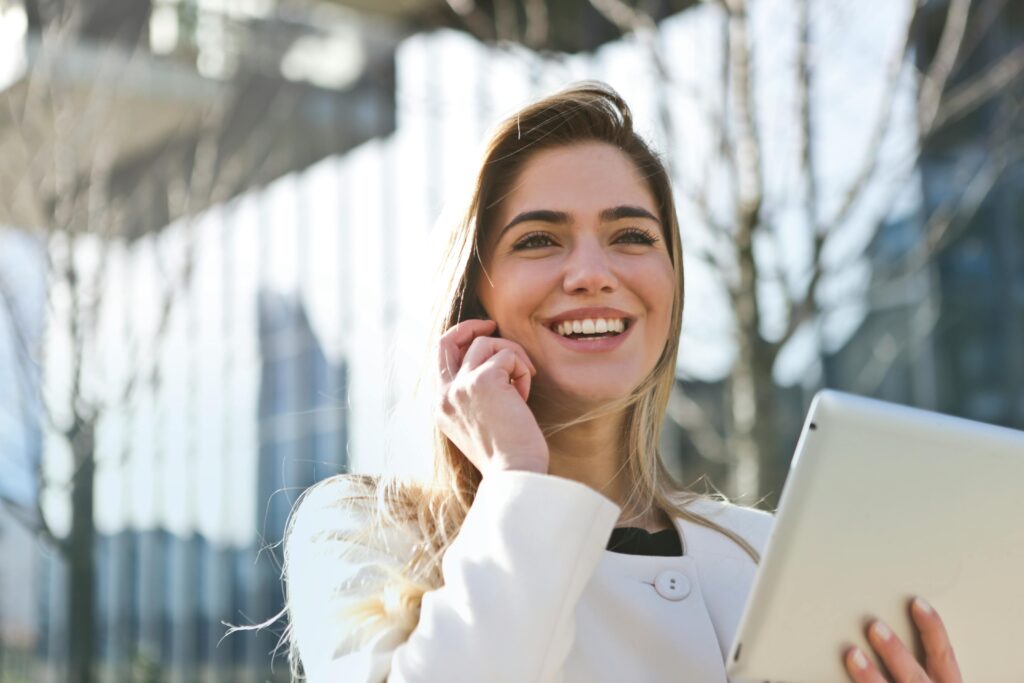 A woman holding a tablet.